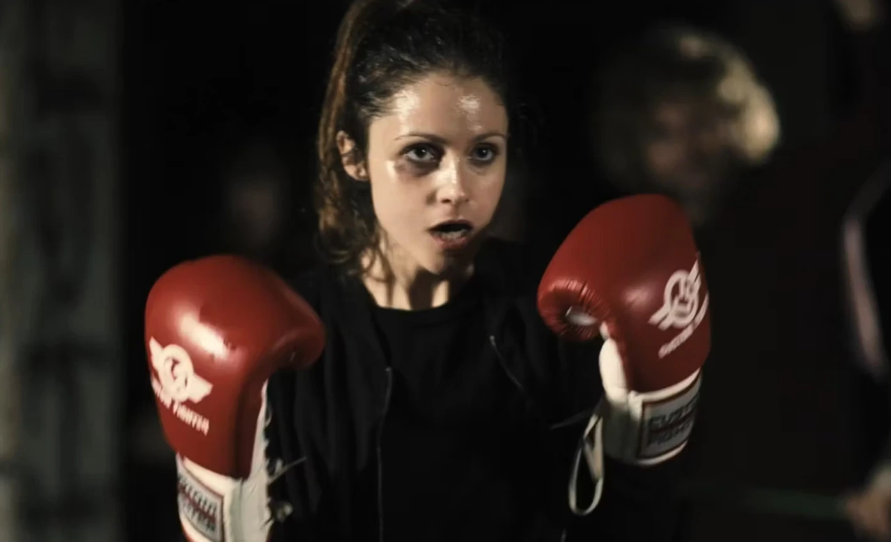 The Prussians music video still: a woman wearing boxing gloves